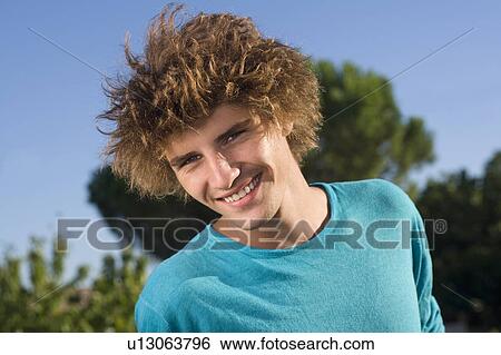 Young man portrait outside View Large Photo Image Stock Photograph - Young man portrait outside. Fotosearch