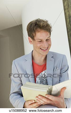 Young man reading View Large Photo Image Stock Image - Young man reading. Fotosearch