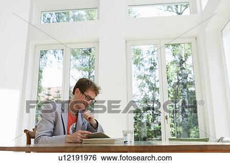 Young man reading View Large Photo Image Stock Photograph - Young man reading. Fotosearch