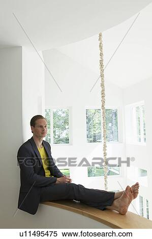 Stock Photography - Young man relaxing. Fotosearch