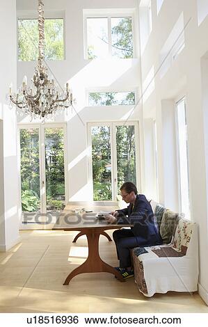 Young man studying some papers View Large Photo Image Stock Photograph - Young man studying some papers. Fotosearch