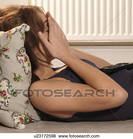Young woman covering her face with hands View Large Photo Image Stock Photo - Young woman covering her face with hands. Fotosearch