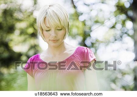 Young woman in nature View Large Photo Image Stock Image - Young woman in nature. Fotosearch
