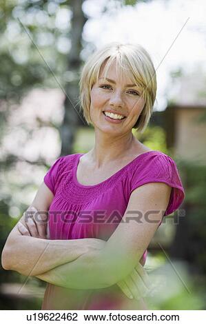 Stock Image - Young woman smiling. Fotosearch