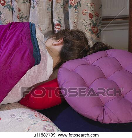 Young woman turned away sleeping View Large Photo Image Stock Photo - Young woman turned away sleeping. Fotosearch