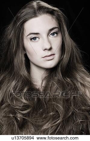 Young woman with long hair View Large Photo Image Picture - Young woman with long hair. Fotosearch