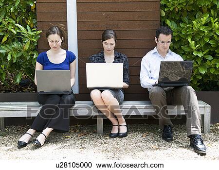 3 colleagues work outdoors View Large Photo Image Stock Image - 3 colleagues work outdoors. Fotosearch