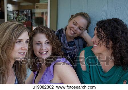 Stock Image - 30 year old Girlfriends get together. Fotosearch