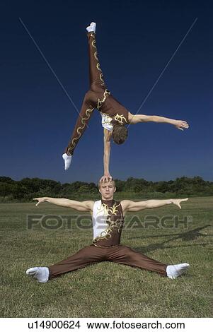 Acrobatic troop performing moves View Large Photo Image Picture - Acrobatic troop performing moves. Fotosearch