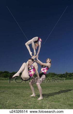 Picture - Acrobatic troop performing moves. Fotosearch