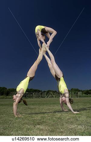Acrobatic troop performing moves View Large Photo Image Stock Image - Acrobatic troop performing moves. Fotosearch