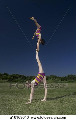 Acrobatic troop performing moves View Large Photo Image Stock Image - Acrobatic troop performing moves. Fotosearch