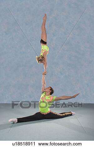 Stock Image - Acrobatic troop performing moves. Fotosearch