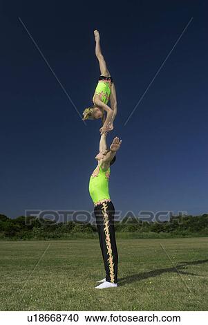 Stock Image - Acrobatic troop performing moves. Fotosearch