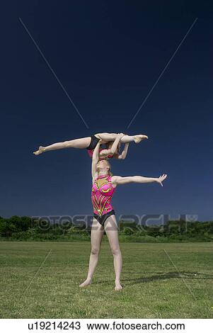 Acrobatic troop performing moves View Large Photo Image Stock Image - Acrobatic troop performing moves. Fotosearch