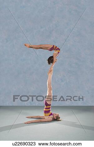 Stock Image - Acrobatic troop performing moves. Fotosearch