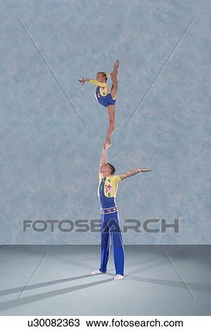 Acrobatic troop performing moves View Large Photo Image Stock Image - Acrobatic troop performing moves. Fotosearch