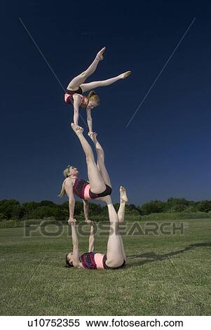 Acrobatic troop performing moves View Large Photo Image Stock Photography - Acrobatic troop performing moves. Fotosearch