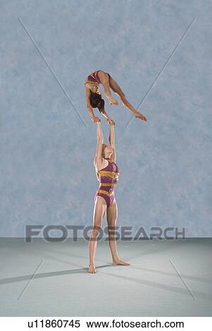 Acrobatic troop performing moves View Large Photo Image Stock Photography - Acrobatic troop performing moves. Fotosearch
