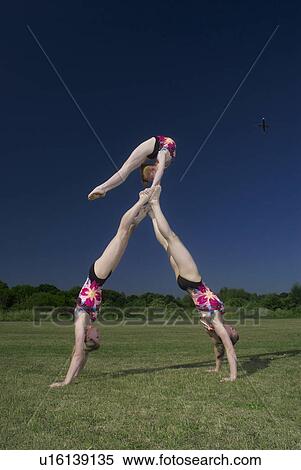 Acrobatic troop performing moves View Large Photo Image Stock Photography - Acrobatic troop performing moves. Fotosearch