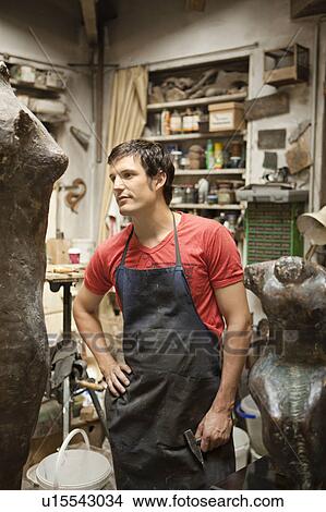 Picture - Artist working on sculpture. Fotosearch