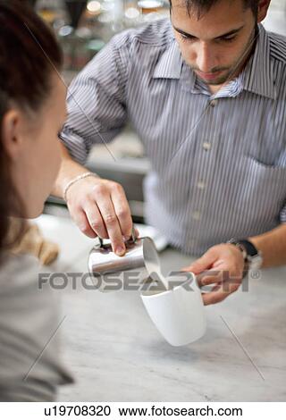 Barkeeper making coffee for woman View Large Photo Image Stock Image - Barkeeper making coffee for woman. Fotosearch