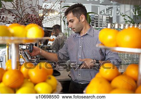 Barkeeper making coffee View Large Photo Image Stock Image - Barkeeper making coffee. Fotosearch