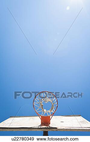 Basket ball hoop against blue sky View Large Photo Image Stock Photo - Basket ball hoop against blue sky. Fotosearch