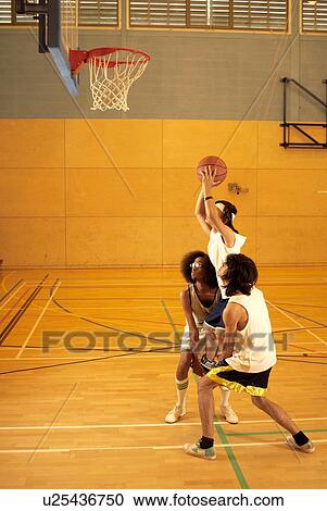 Basketball players lifting a player View Large Photo Image Stock Image - Basketball players lifting a player. Fotosearch