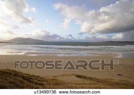 Beach at sunset View Large Photo Image Stock Photograph - Beach at sunset. Fotosearch