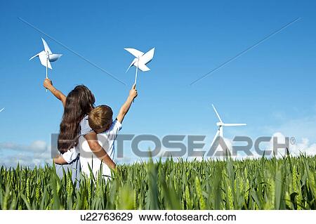 Boy and girl with wind turbine View Large Photo Image Stock Photo - Boy and girl with wind turbine. Fotosearch