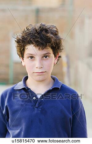 Boy looking to camera on a sunny day View Large Photo Image Stock Image - Boy looking to camera on a sunny day. Fotosearch