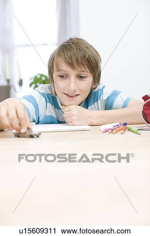 Boy playing with little car View Large Photo Image Stock Image - Boy playing with little car. Fotosearch
