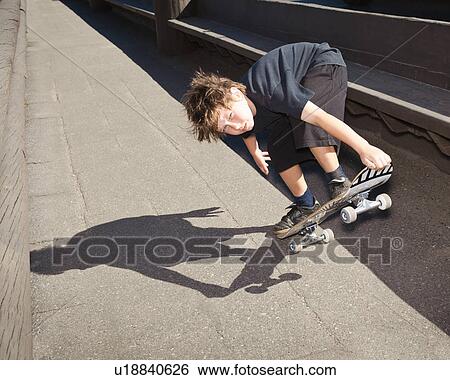 Stock Photograph - Boy Skate boarding. Fotosearch