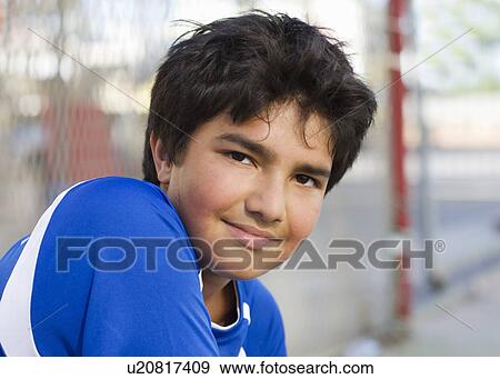 Stock Photo - Boy smiling to the camera. Fotosearch