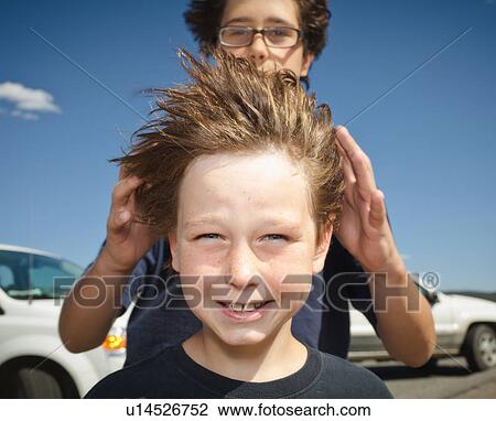 Boys hair blowing in the wind View Large Photo Image Stock Image - Boys hair blowing in the wind. Fotosearch