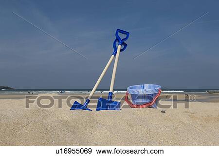 Bucket and spades by the seaside View Large Photo Image Stock Photo - Bucket and spades by the seaside. Fotosearch