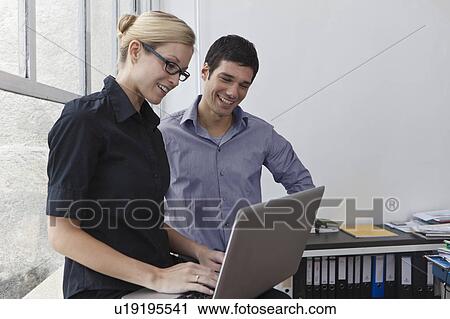 Business colleagues laughing View Large Photo Image Stock Image - Business colleagues laughing. Fotosearch