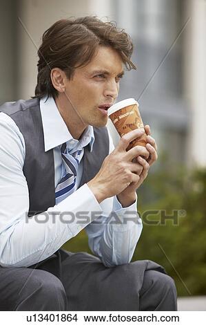 Business man taking a coffee break View Large Photo Image Picture - Business man taking a coffee break. Fotosearch