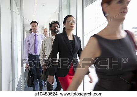 Business people rushing past camera View Large Photo Image Picture - Business people rushing past camera. Fotosearch
