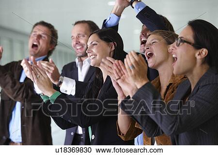Business team applauding, smiling View Large Photo Image Stock Image - Business team applauding, smiling. Fotosearch