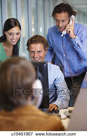 Business team closing a deal View Large Photo Image Stock Photo - Business team closing a deal. Fotosearch