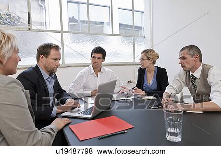 Business team discussing their strategy View Large Photo Image Stock Photo - Business team discussing their strategy. Fotosearch