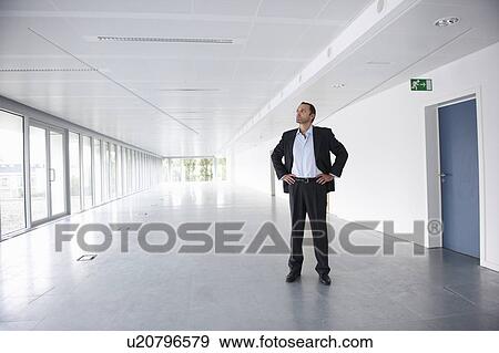 Stock Photo - Businessman in an empty office. Fotosearch