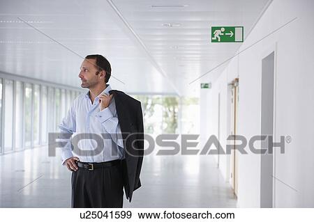 Stock Photo - Businessman in an empty office. Fotosearch