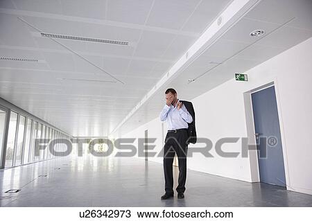 Businessman in an empty open space View Large Photo Image Stock Image - Businessman in an empty open space. Fotosearch