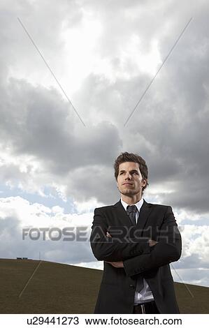 Stock Image - Businessman looking ahead. Fotosearch