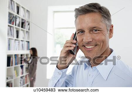 Stock Image - Businessman phoning. Fotosearch