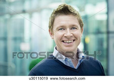 Stock Photo - Businessman smiling to camera. Fotosearch