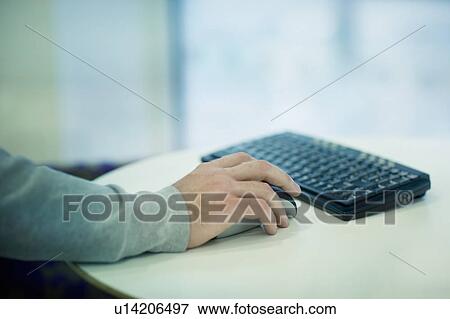 Businessman's hand on computer mouse View Large Photo Image Stock Photo - Businessman's hand on computer mouse. Fotosearch